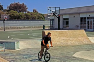 Skateboard park and basketball court near recreation center at Leo Ryan Park