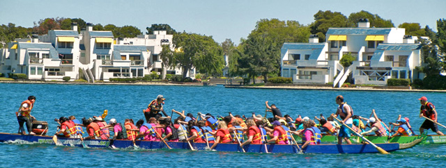 Dragon boat race on the lagoon. See the drummer in front & steersman in back.